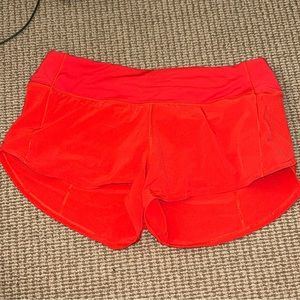 Carnation red lululemon speed up short 2.5”